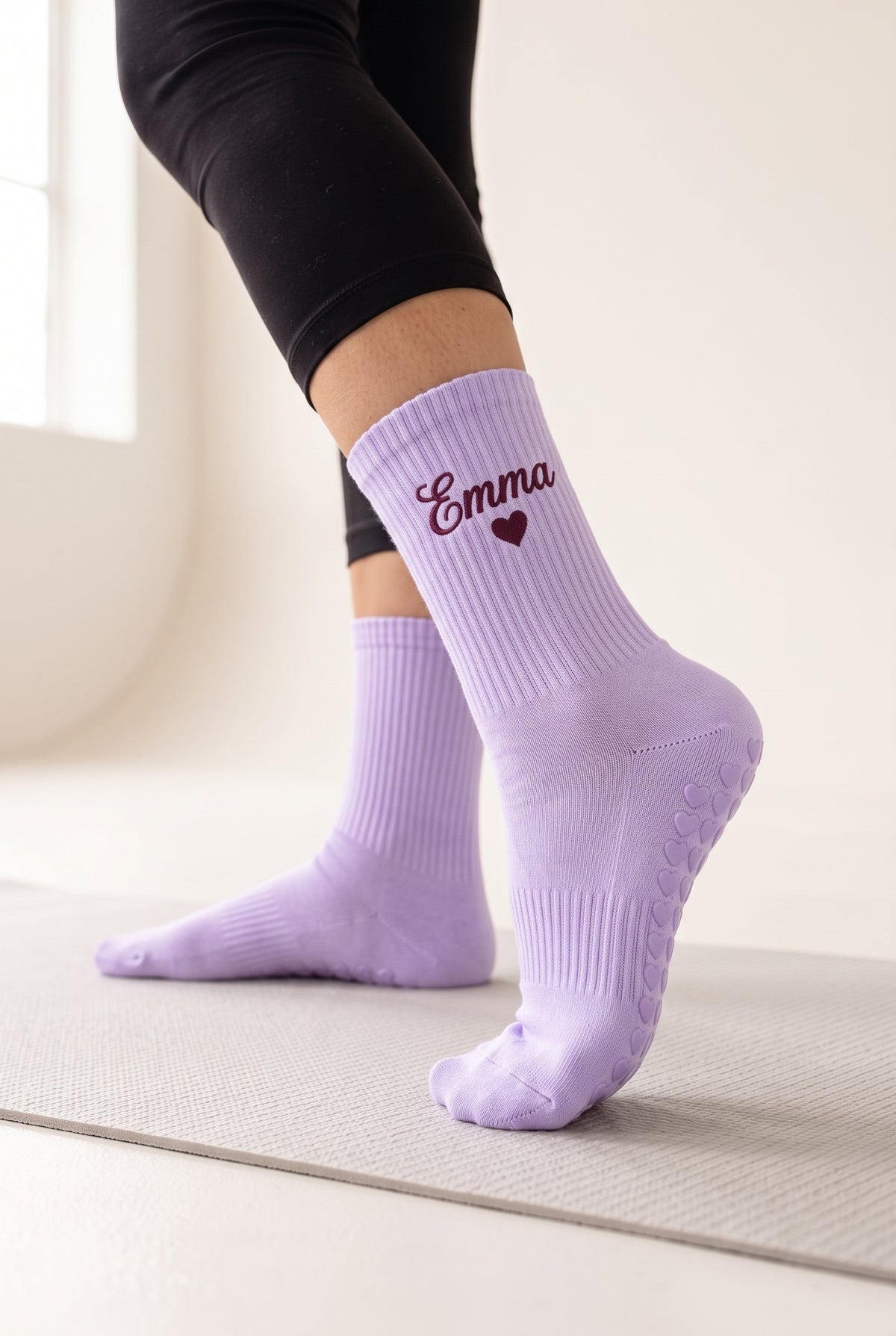 Lilac pilates grip socks, worn, seen from the heel — embroidered to order