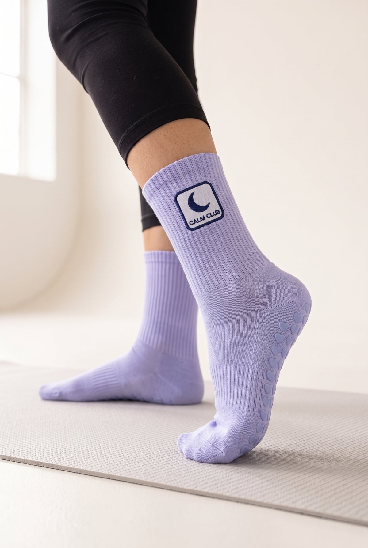 Ice Blue pilates grip socks, worn, seen from the heel — embroidered to order