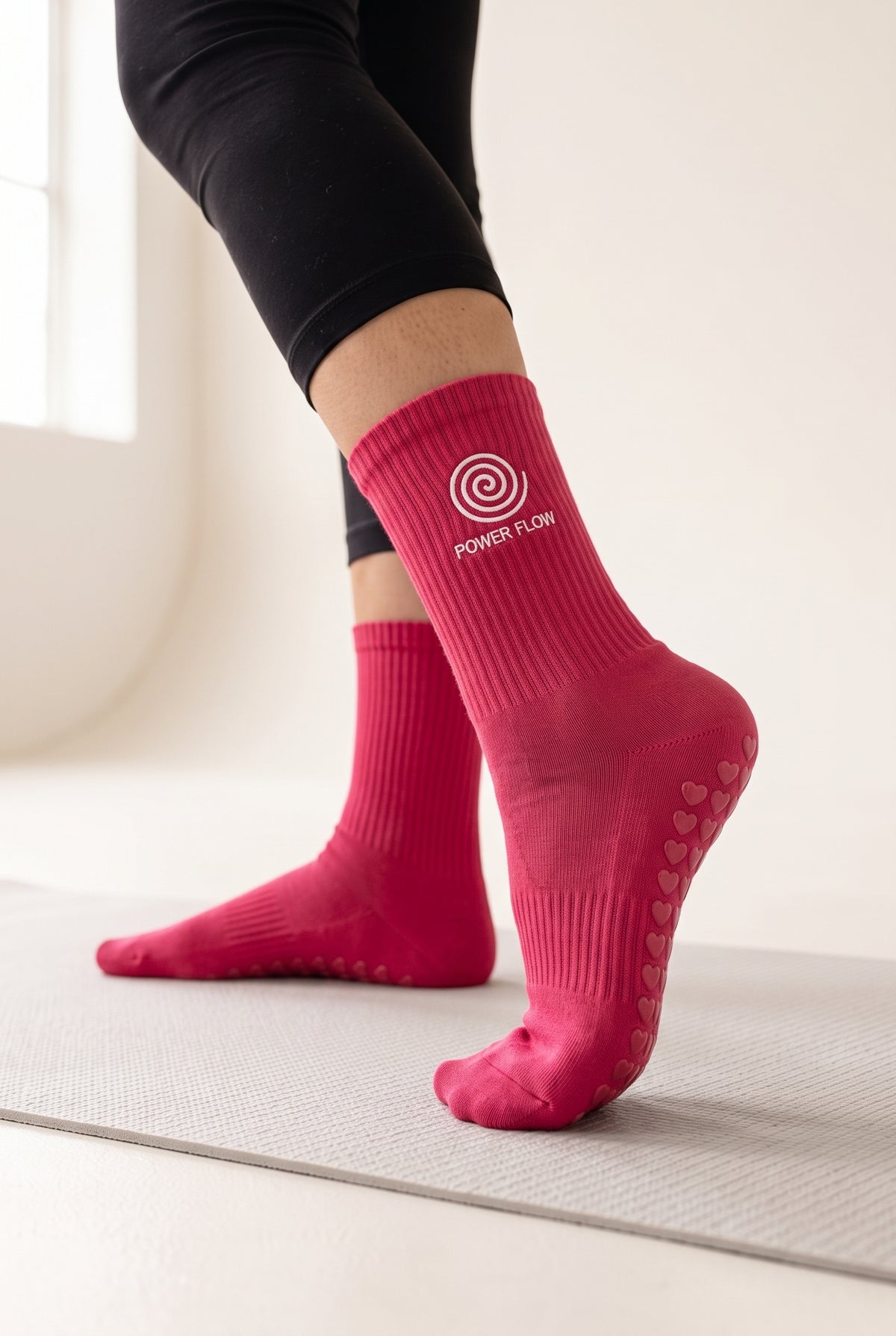 Red pilates grip socks, worn, seen from the heel — embroidered to order