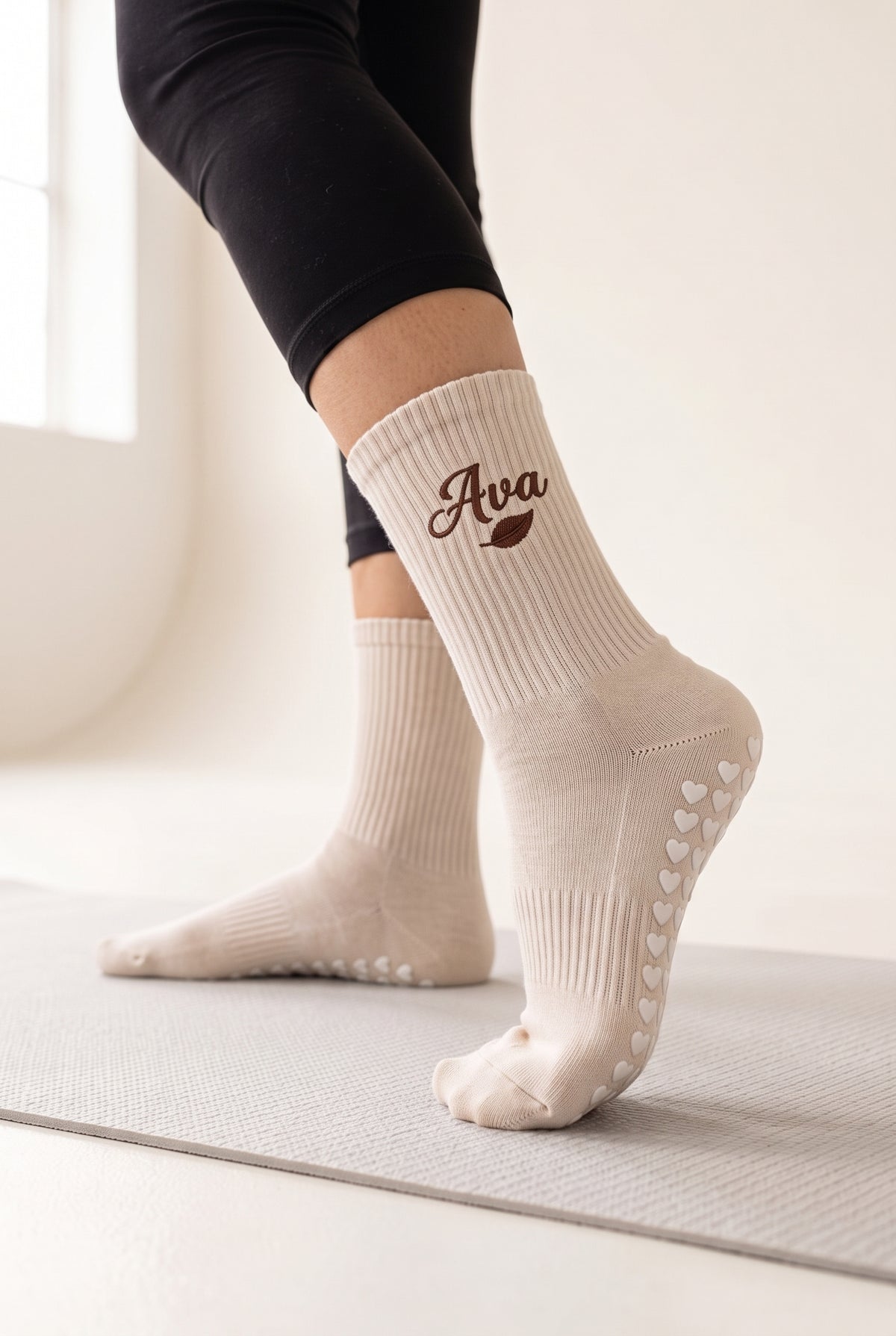 Beige pilates grip socks, worn, seen from the heel — embroidered to order