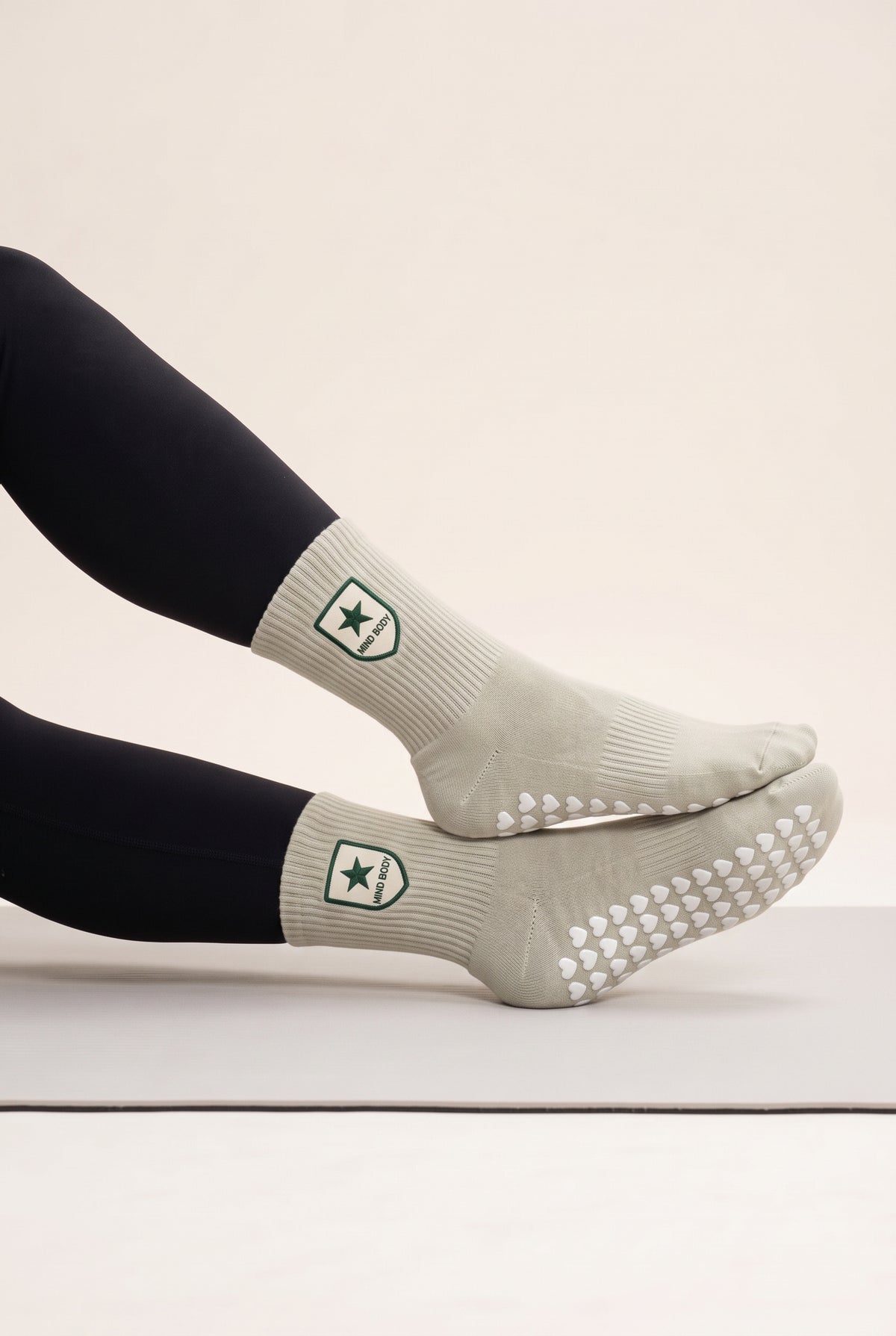 Khaki pilates grip socks, worn, side view — embroidered to order