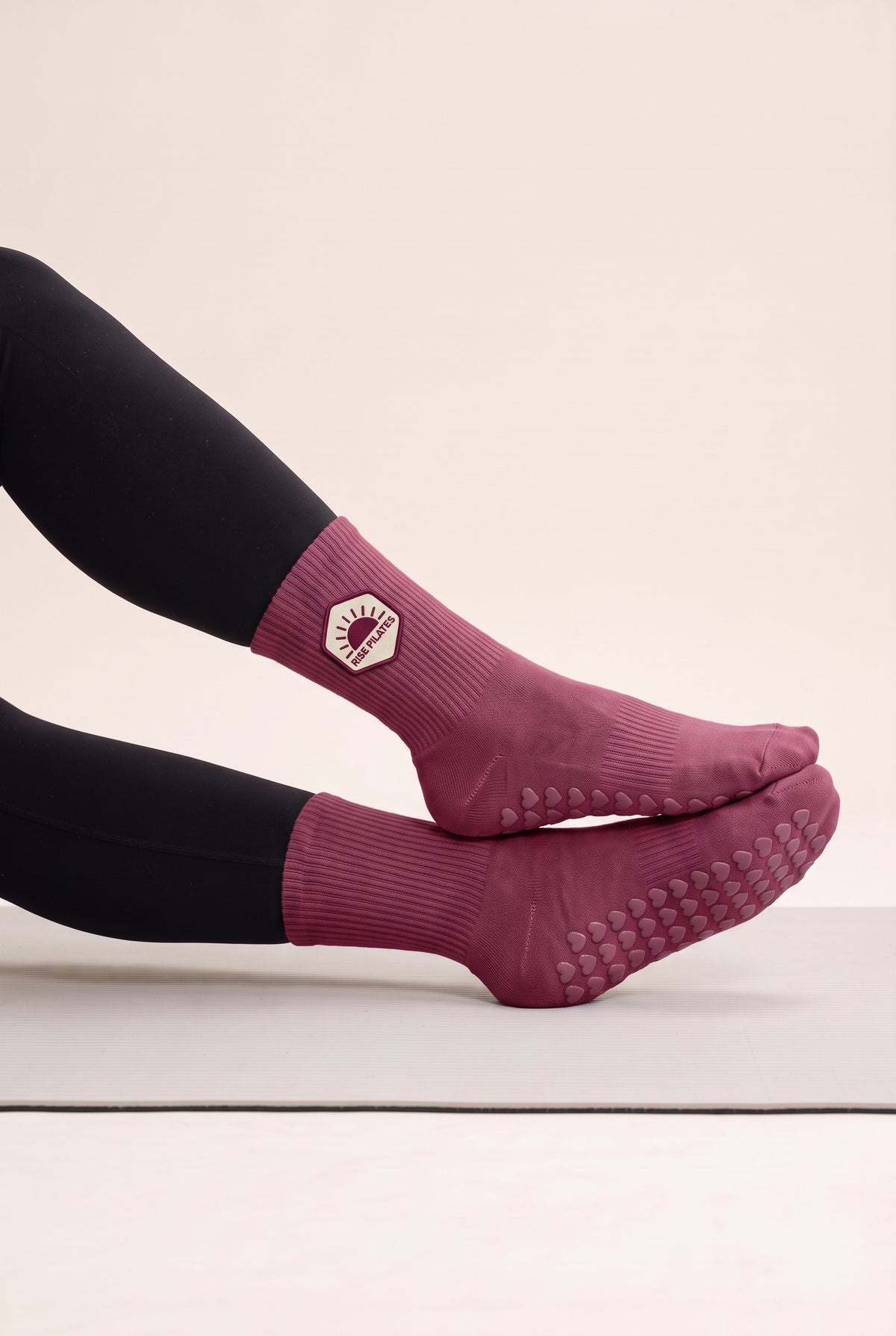 Burgundy pilates grip socks, worn, side view — embroidered to order