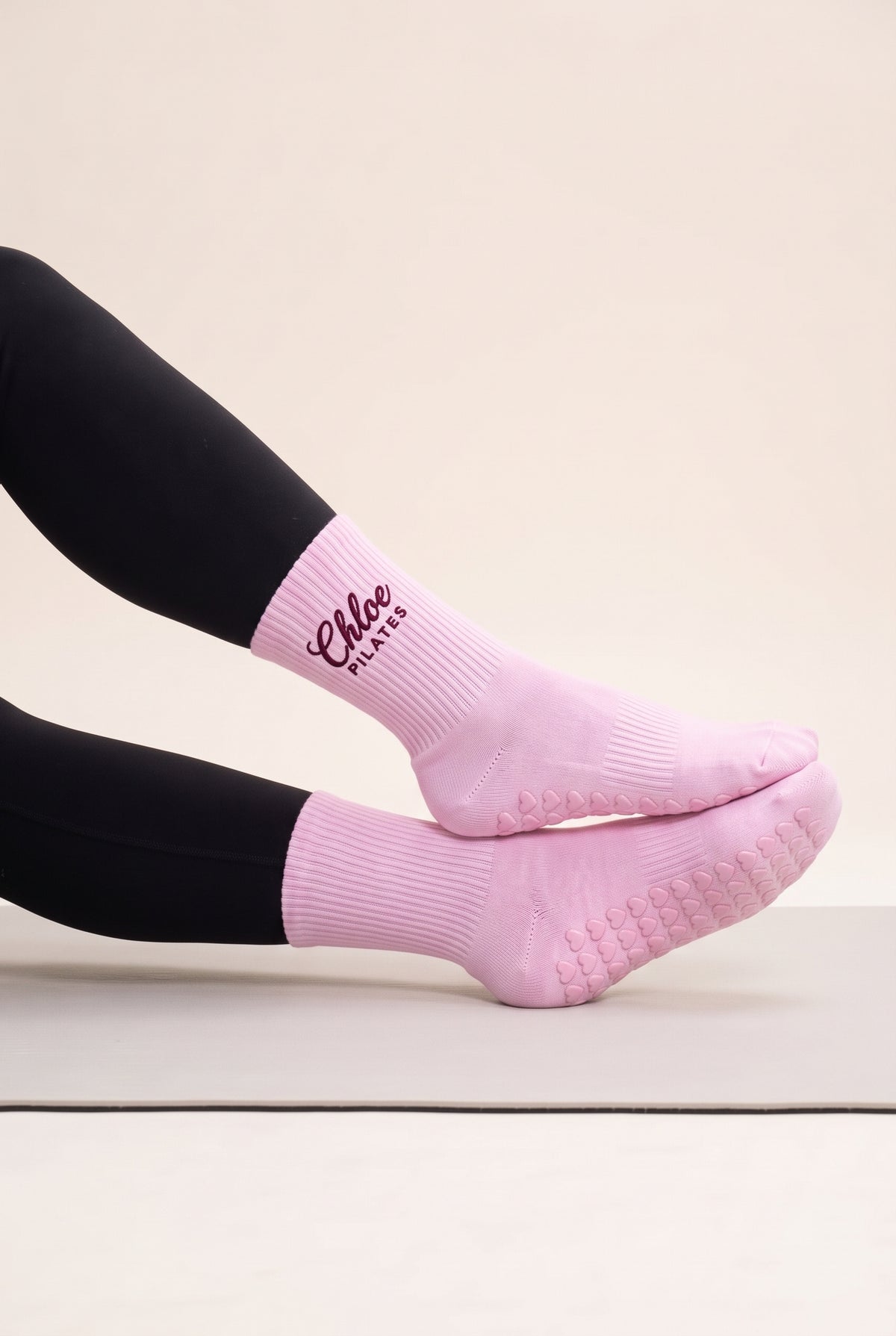 Pink pilates grip socks, worn, side view — embroidered to order