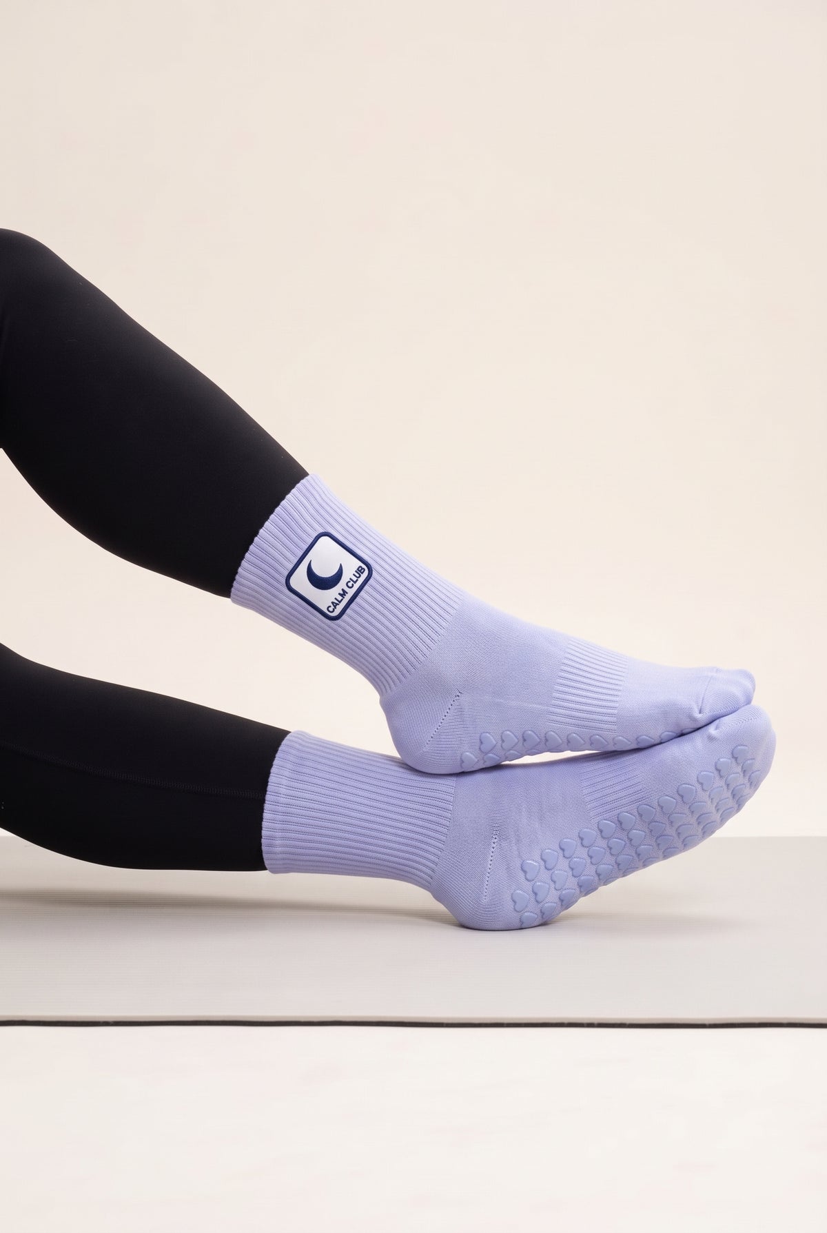 Ice Blue pilates grip socks, worn, side view — embroidered to order