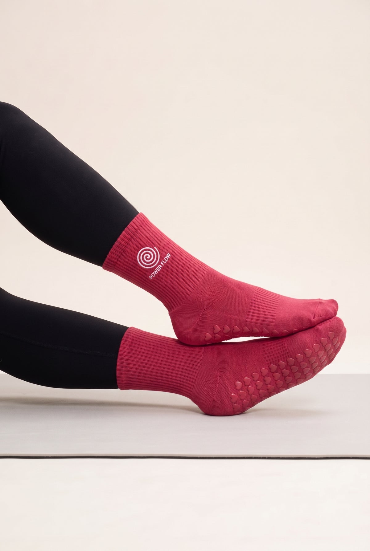 Red pilates grip socks, worn, side view — embroidered to order