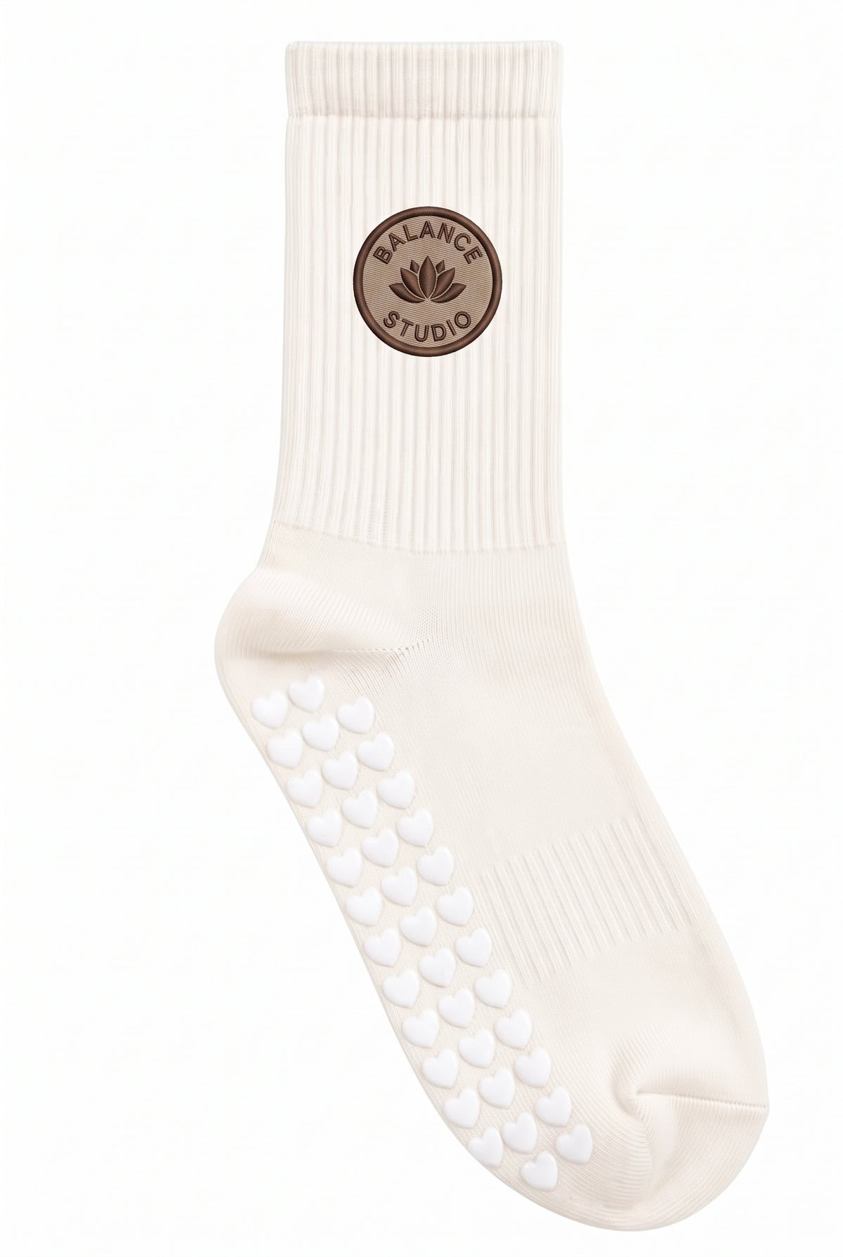 Cream pilates grip socks, close-up of the custom embroidery on the ankle — embroidered to order