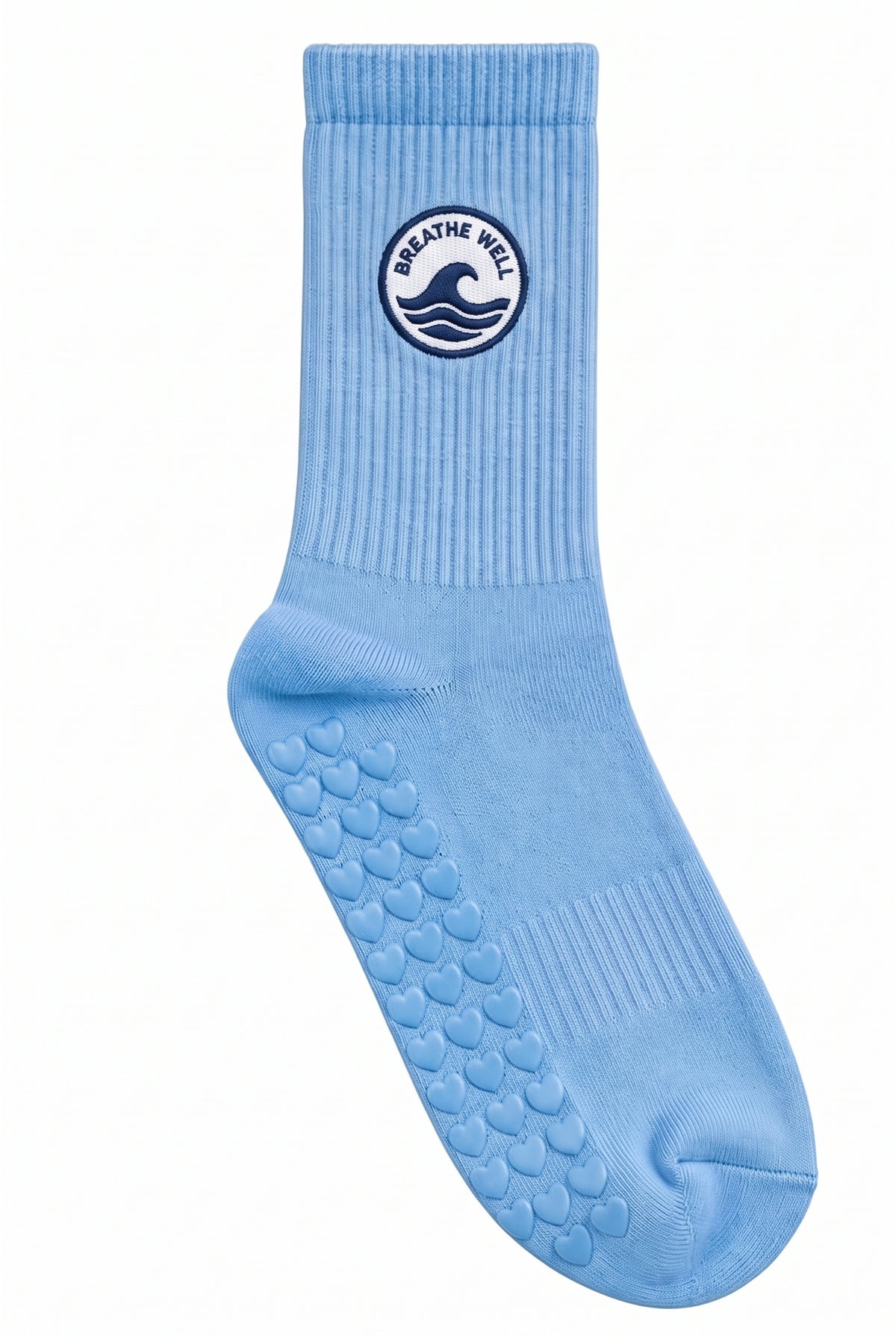 Blue pilates grip socks, close-up of the custom embroidery on the ankle — embroidered to order