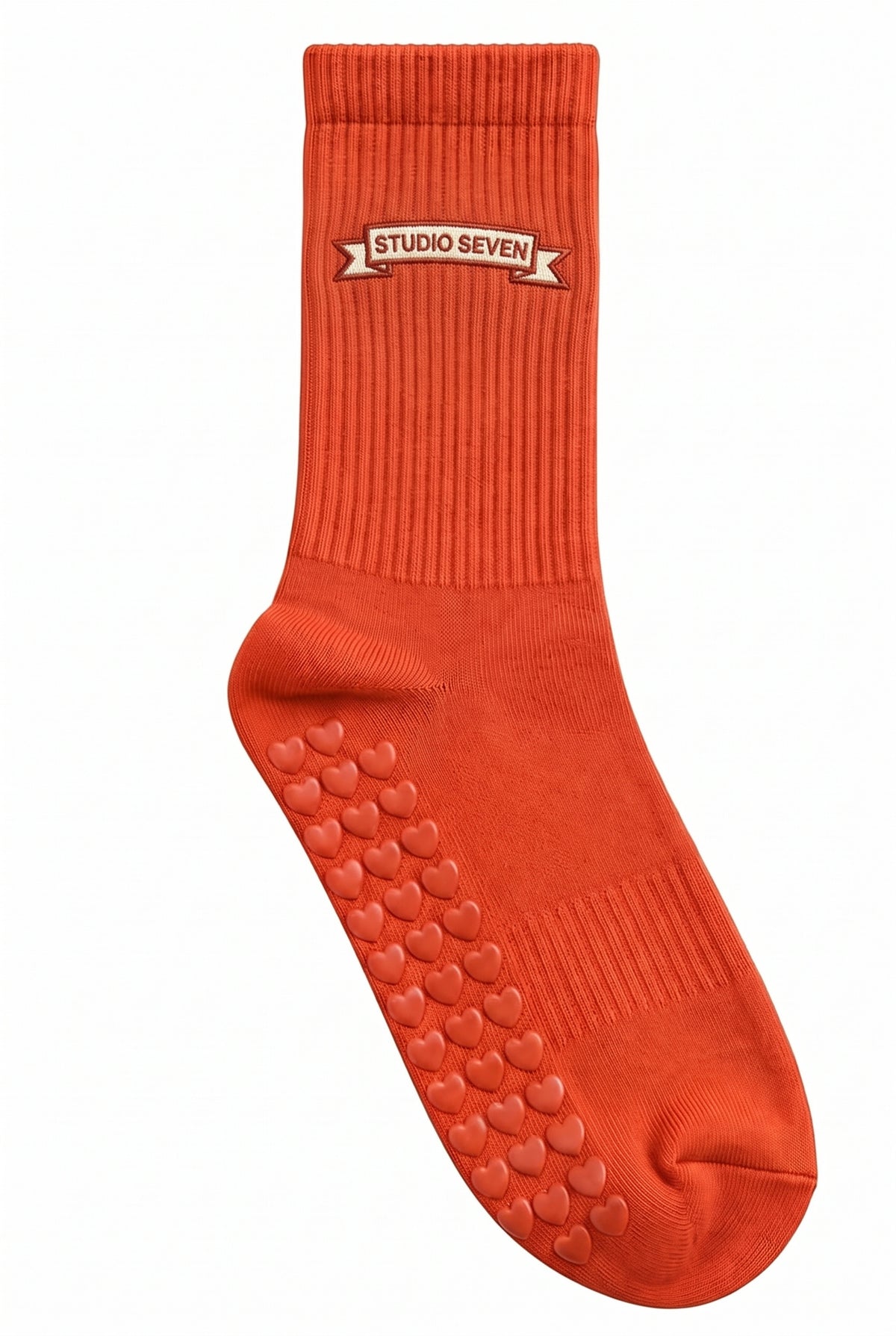 Orange pilates grip socks, close-up of the custom embroidery on the ankle — embroidered to order