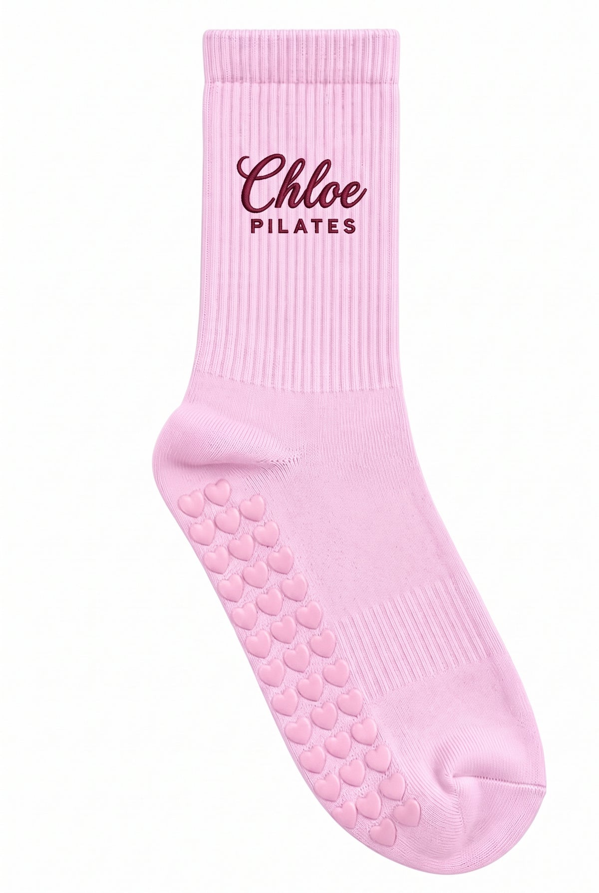 Pink pilates grip socks, close-up of the custom embroidery on the ankle — embroidered to order