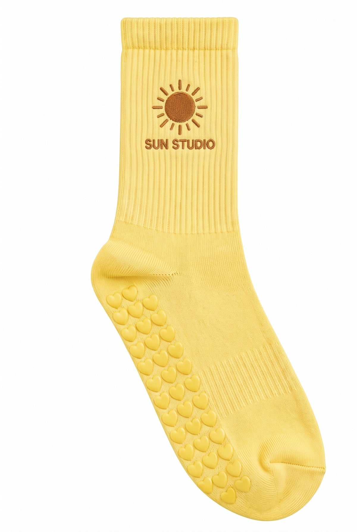 Yellow pilates grip socks, close-up of the custom embroidery on the ankle — embroidered to order
