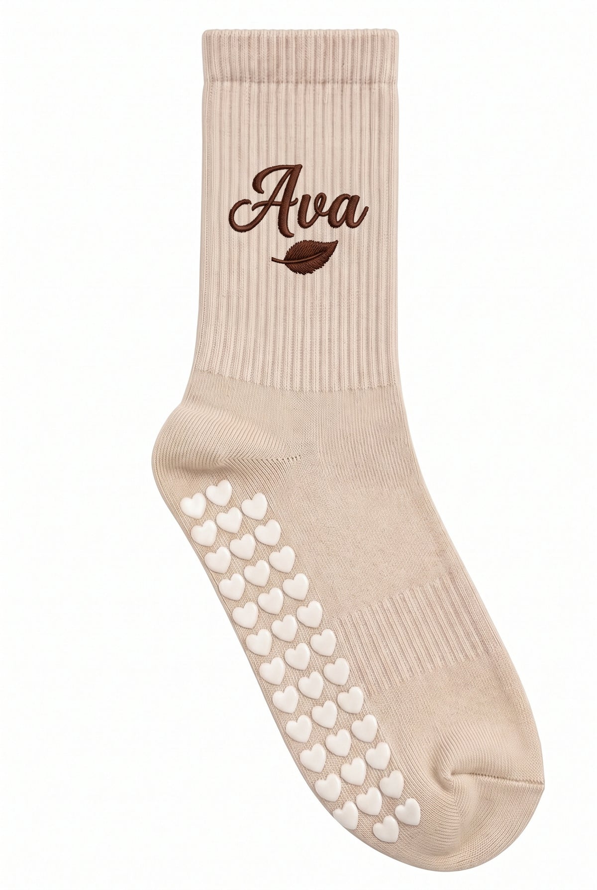 Beige pilates grip socks, close-up of the custom embroidery on the ankle — embroidered to order