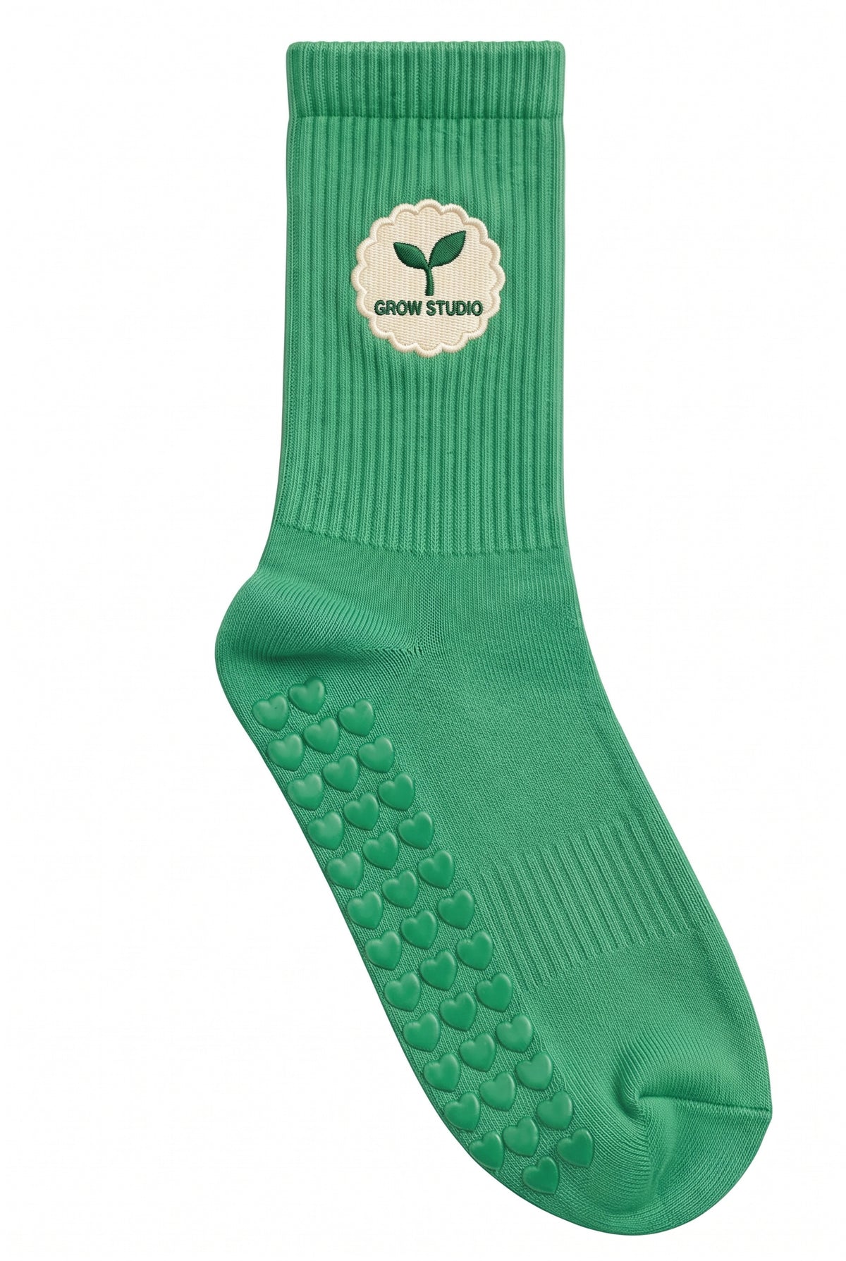 Green pilates grip socks, close-up of the custom embroidery on the ankle — embroidered to order