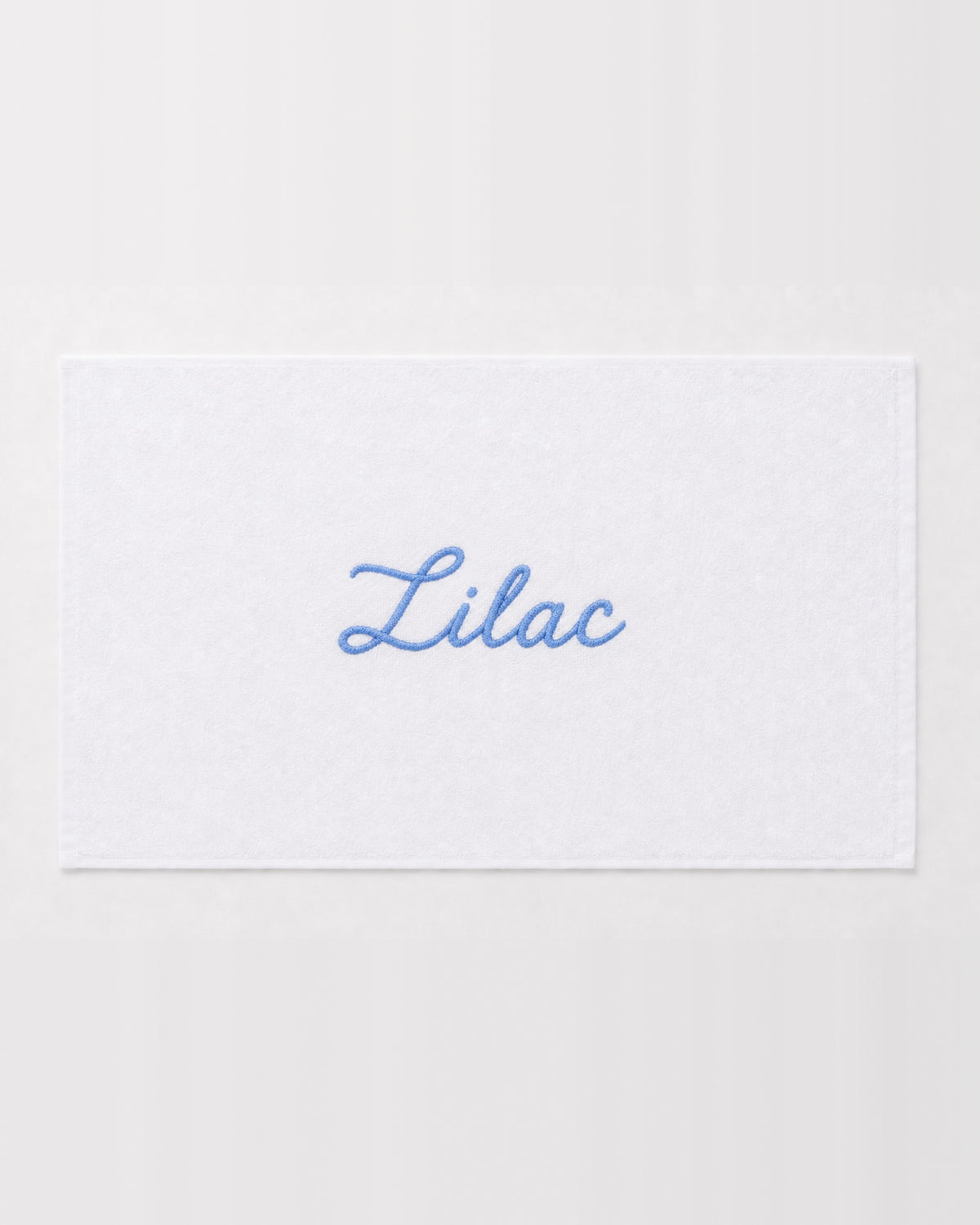 Lilac personalized bamboo hand towel, sky blue script embroidery on white