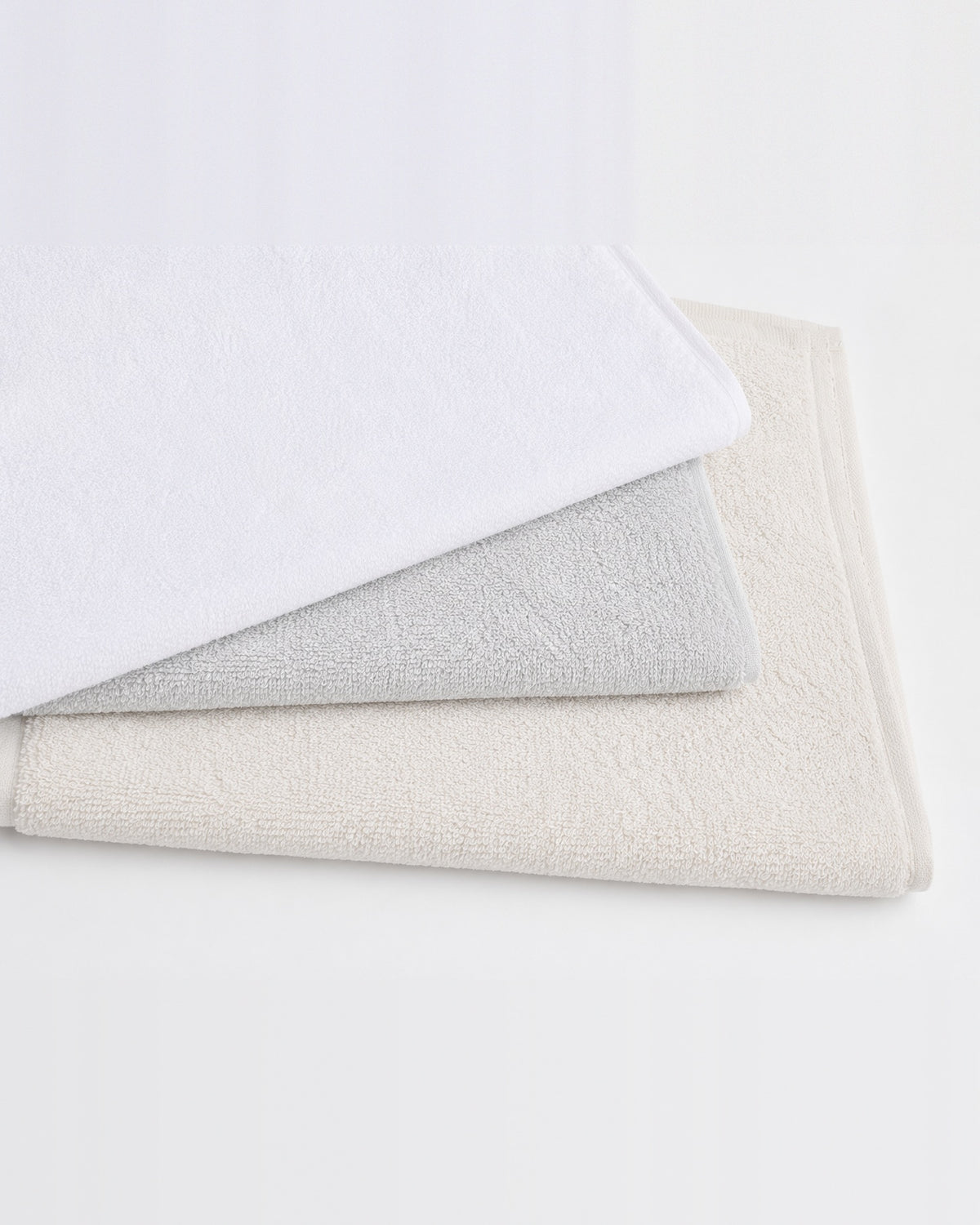 Plain bamboo hand towels in white, light gray and ivory
