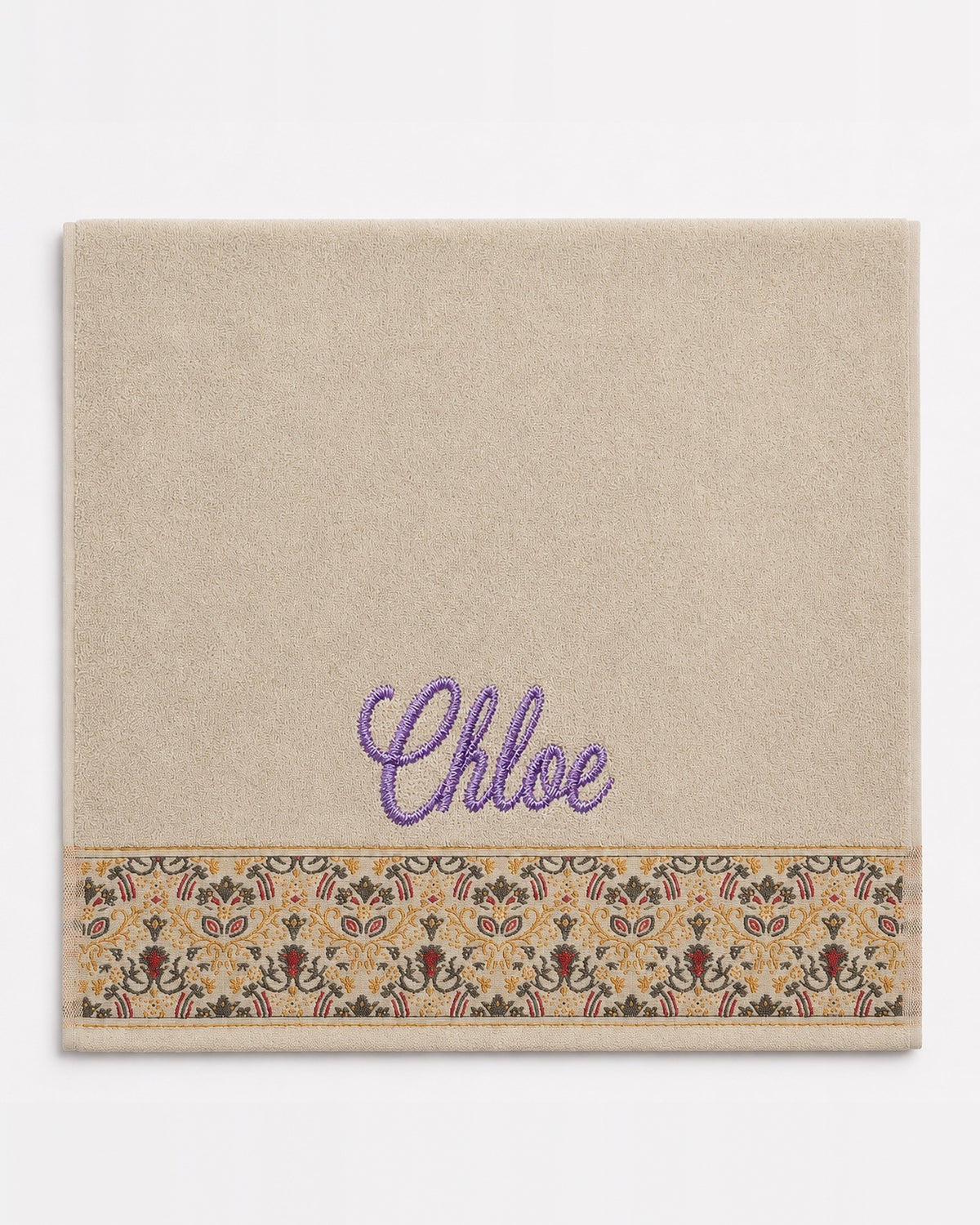 Chloe personalized hair towel, purple script embroidery on cream cotton with a patterned border