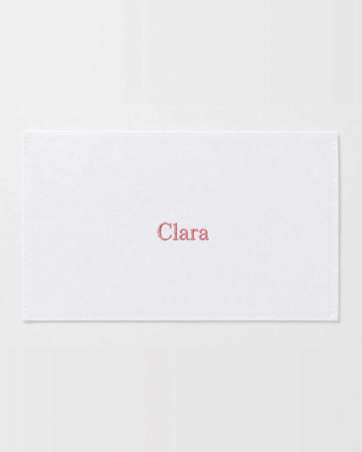 Clara personalized bamboo hand towel, pink serif embroidery on white